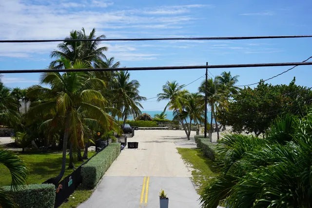 a view of a street with a building in the background