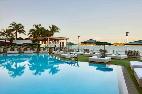 a view of swimming pool with outdoor seating