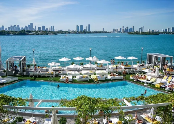 a view of swimming pool with outdoor seating