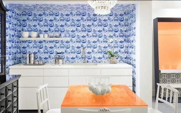 a dining room with a table and chairs