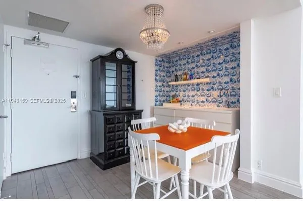 a living room with furniture a table and chairs