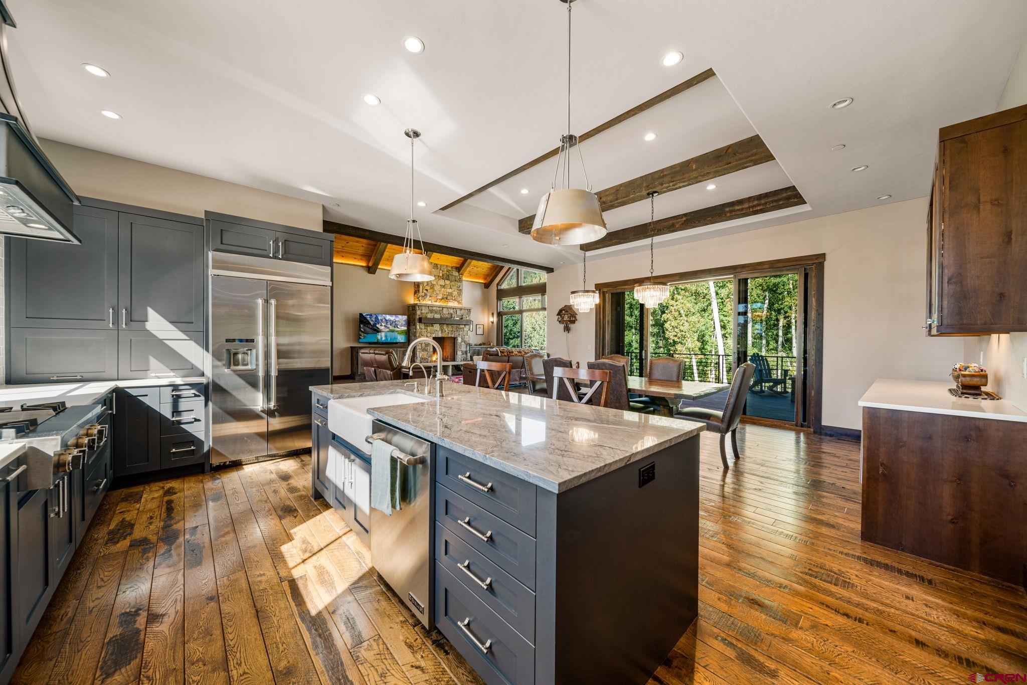 212 2 Dogs Trail Durango, CO 81301 - Photo 15 of 45 a kitchen with sink stove and view living room