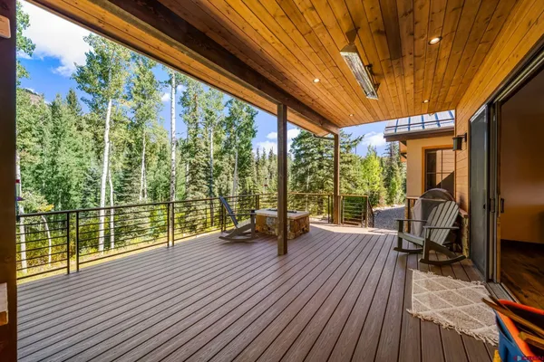 a view of living room with furniture and wooden floor