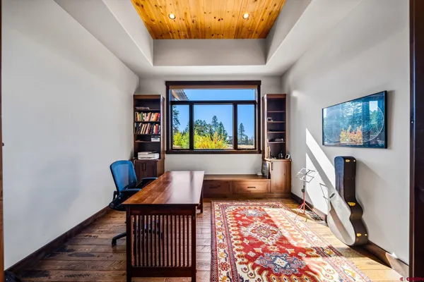 a living room with furniture and a rug