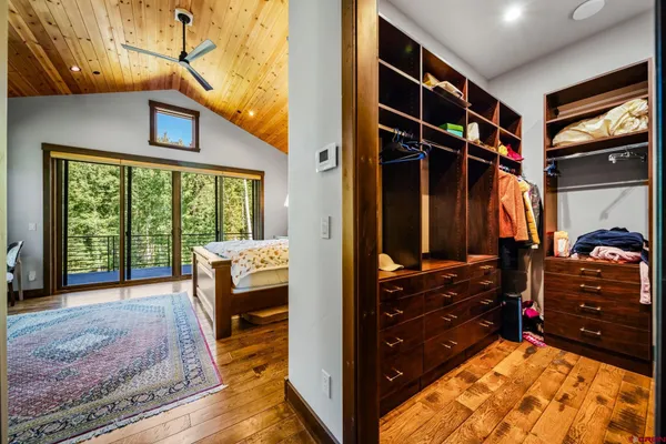 a view of a bedroom with furniture and a window
