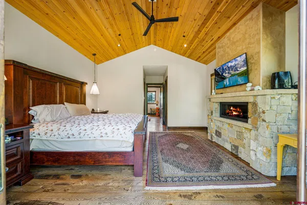 a bedroom with a bed and a fireplace