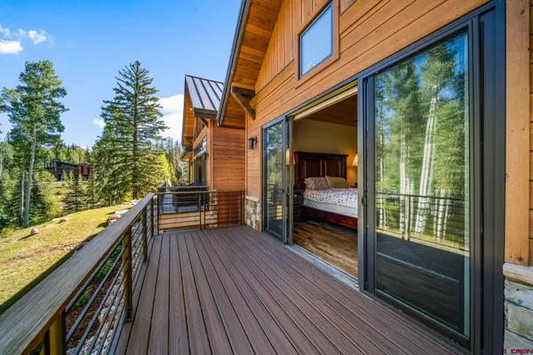 a view of balcony with couch and wooden floor