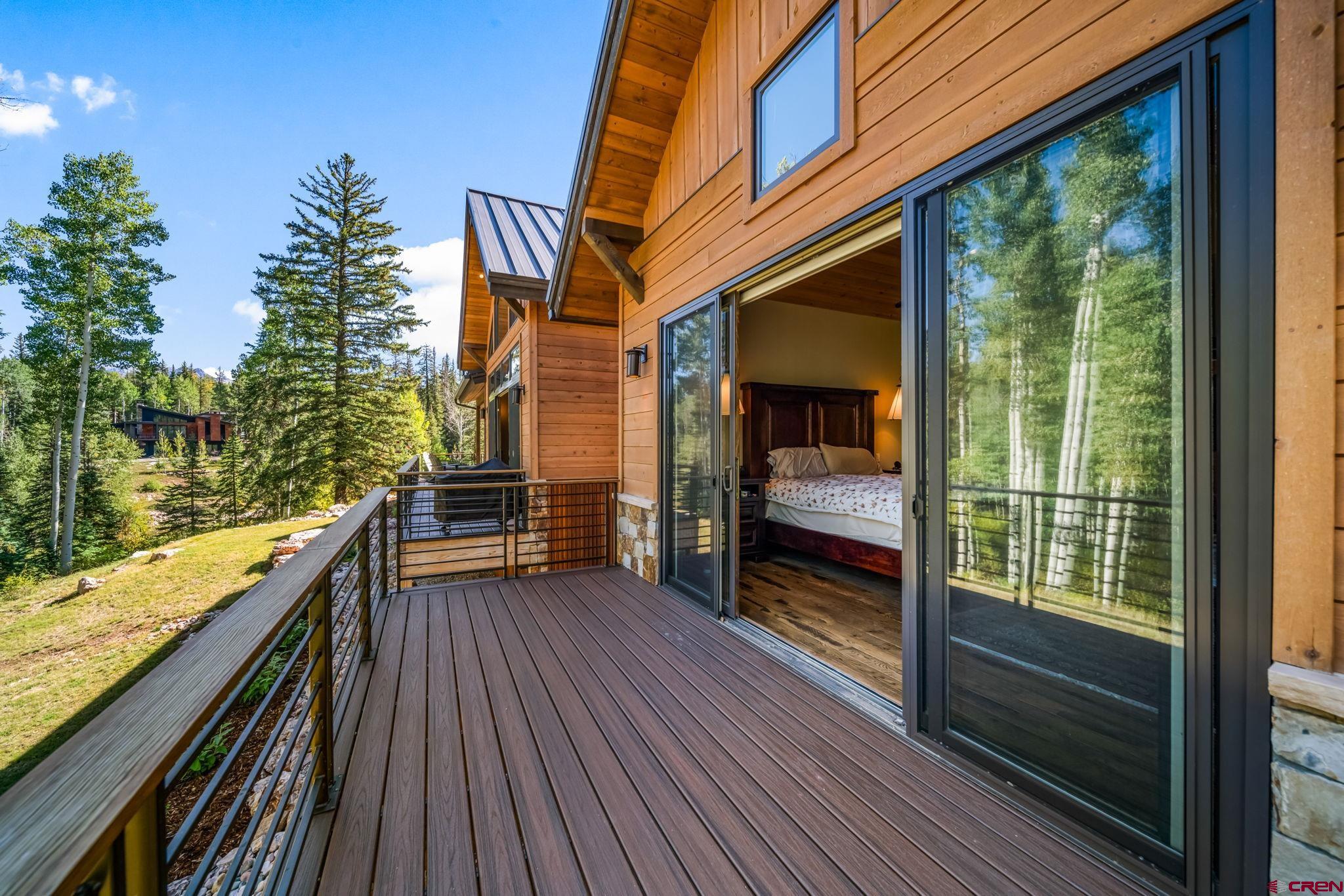 212 2 Dogs Trail Durango, CO 81301 - Photo 27 of 45 a view of balcony with couch and wooden floor