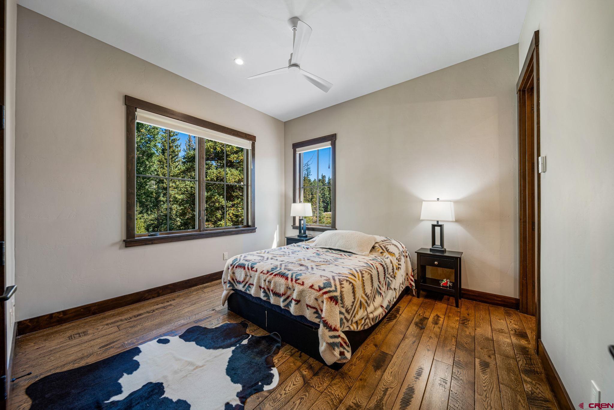 212 2 Dogs Trail Durango, CO 81301 - Photo 35 of 45 a bedroom with a bed and window