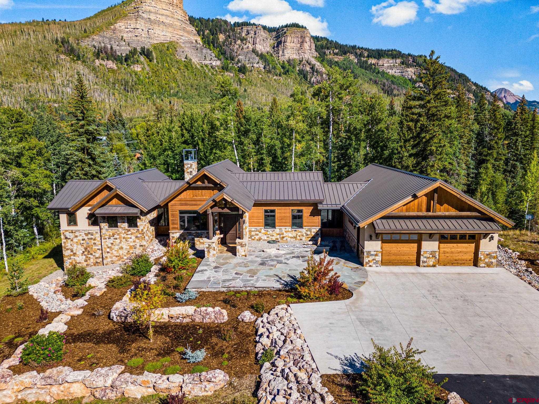 212 2 Dogs Trail Durango, CO 81301 - Photo 40 of 45 front view of a house with a yard
