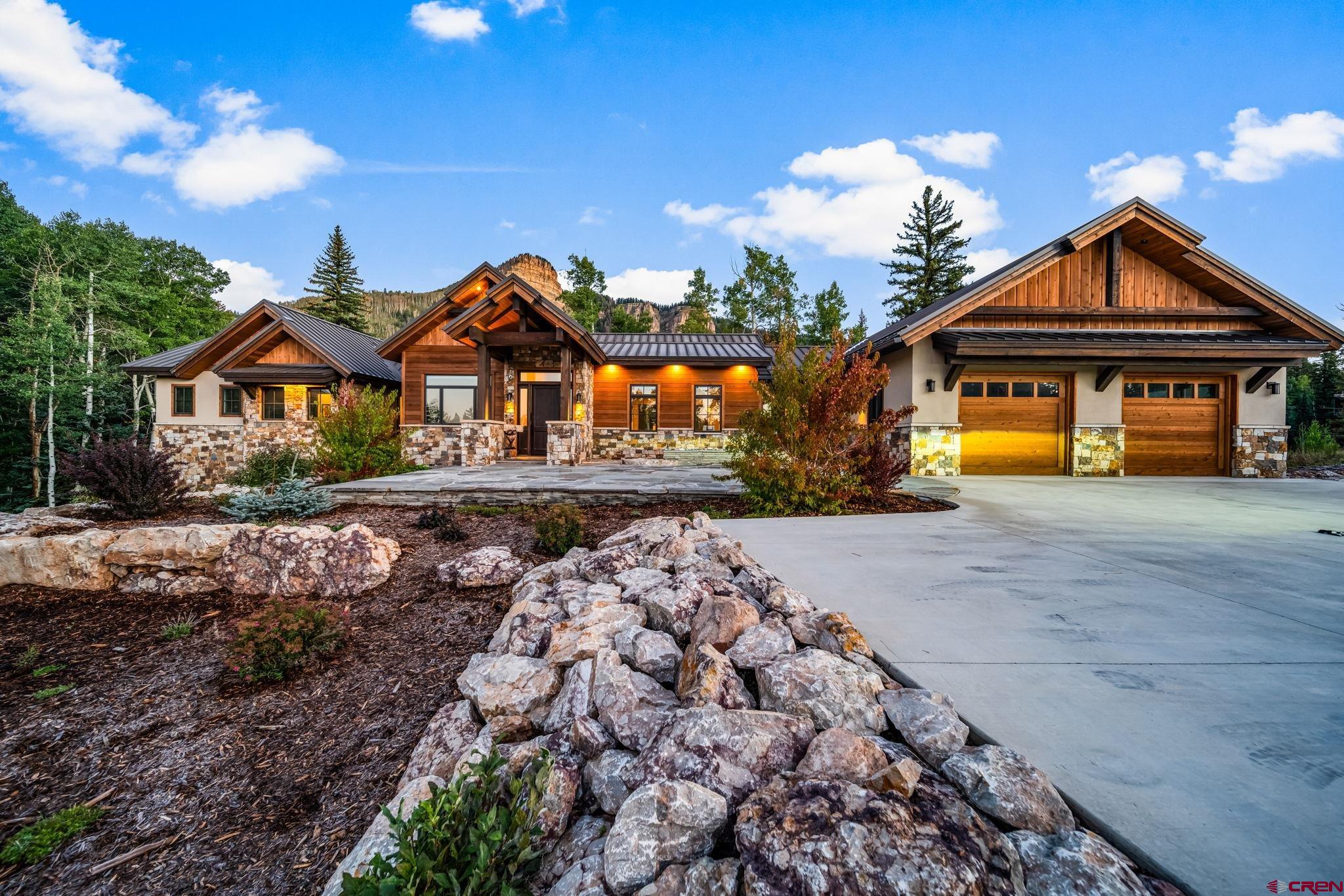 212 2 Dogs Trail Durango, CO 81301 - Photo 41 of 45 a front view of a house with a yard
