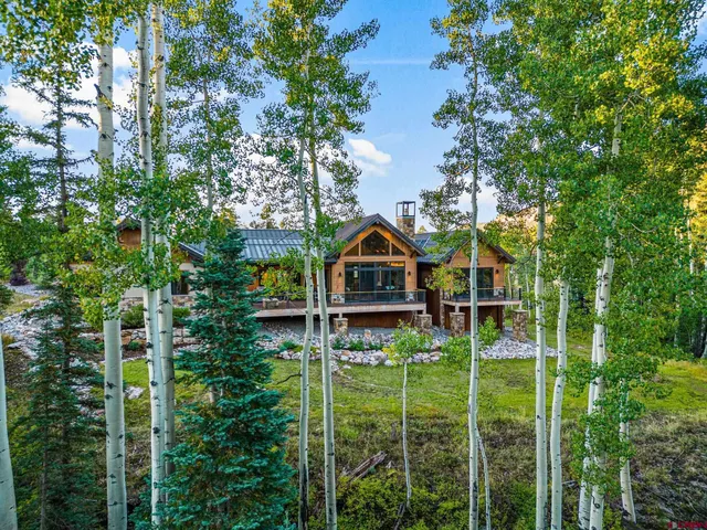 a backyard of a house with lots of green space