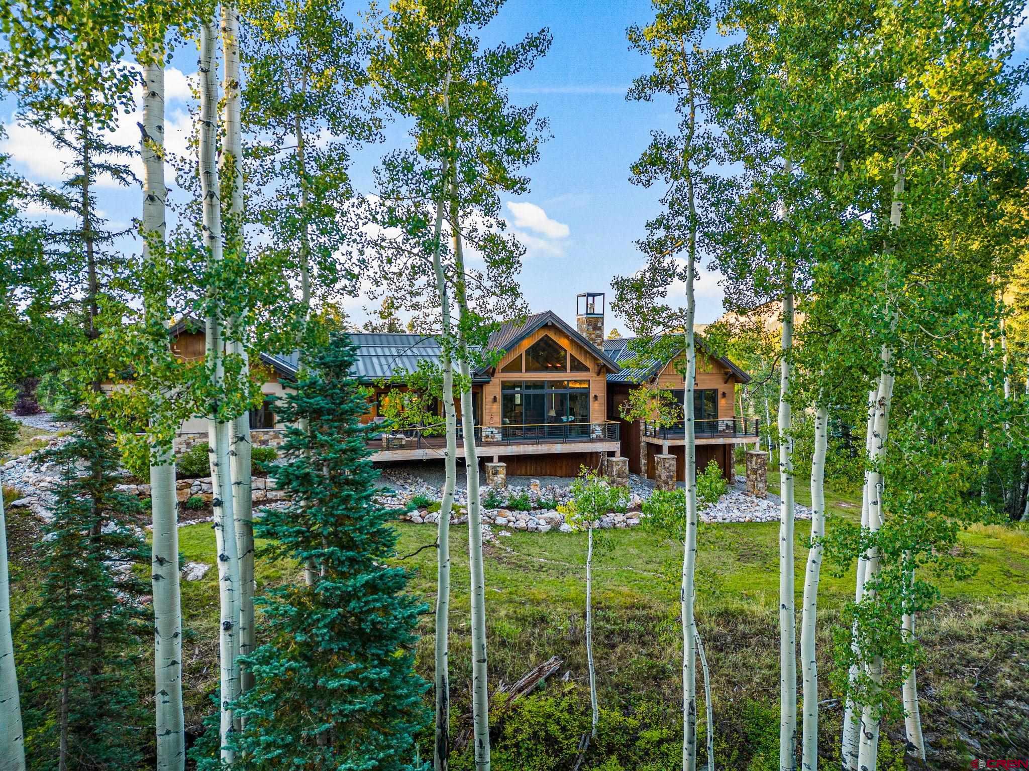 212 2 Dogs Trail Durango, CO 81301 - Photo 43 of 45 a backyard of a house with lots of green space