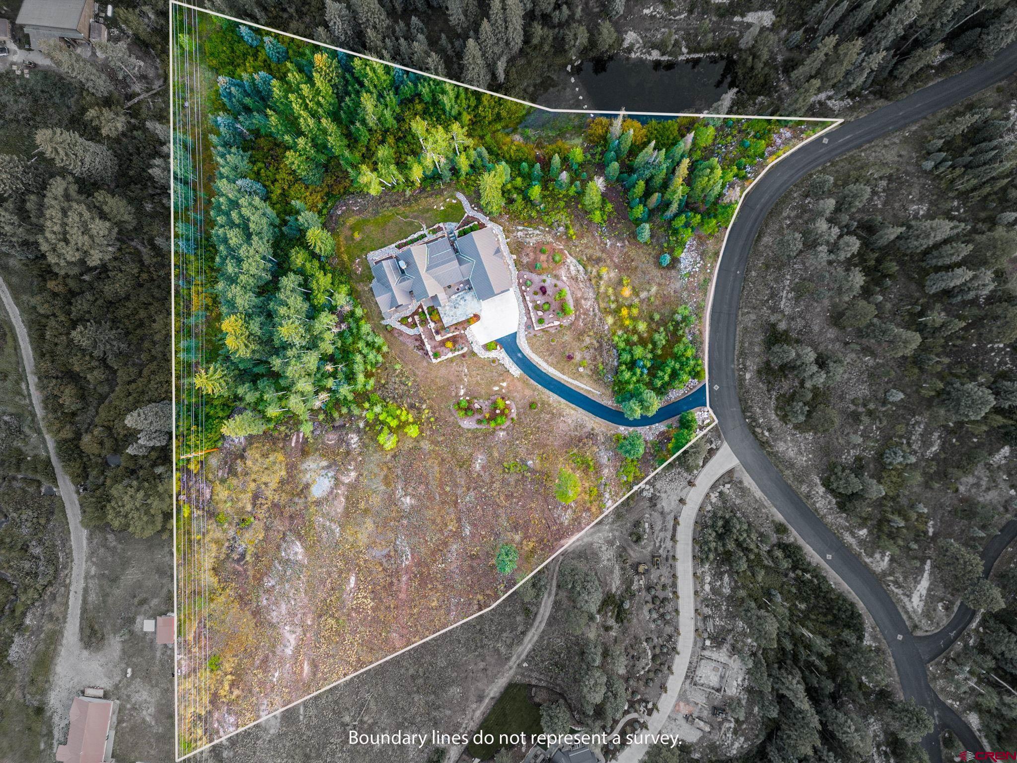 212 2 Dogs Trail Durango, CO 81301 - Photo 44 of 45 a view of a backyard with plants