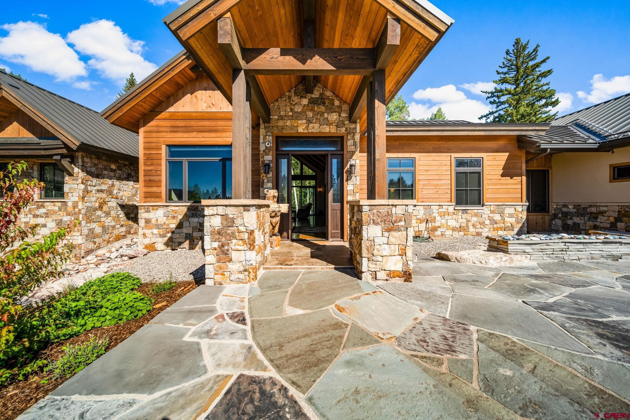 212 2 Dogs Trail Durango, CO 81301 - Photo 6 of 45 a view of a house with a patio