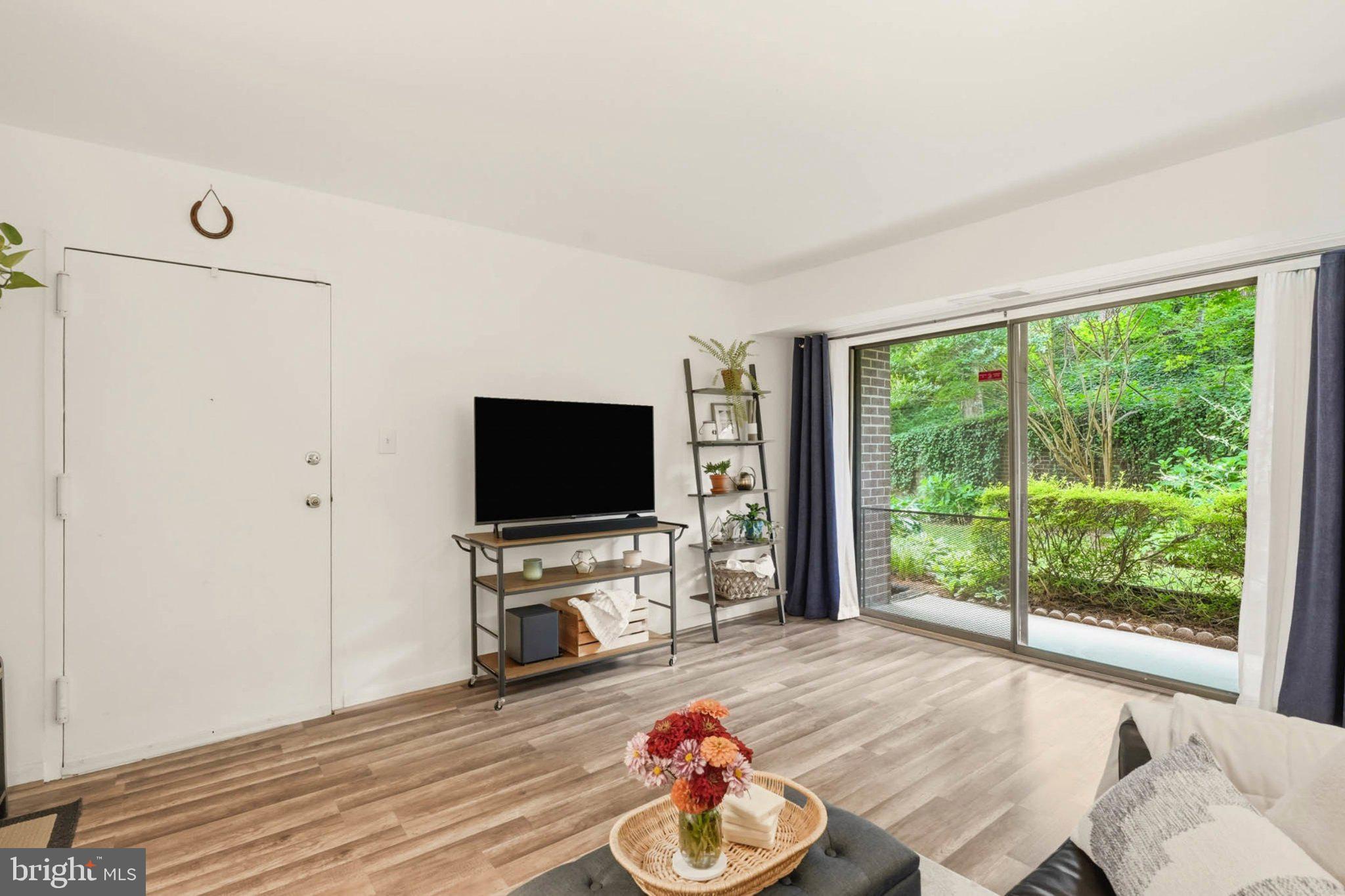 17816 Buehler Road, Unit 1B1 164 Olney, MD 20832 - Photo 6 of 29 Serene living space with garden view.