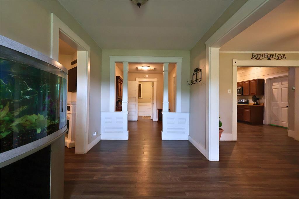 210 Hopkins Street Alba, TX 75410 - Photo 12 of 36 Corridor featuring dark wood-type flooring and baseboards