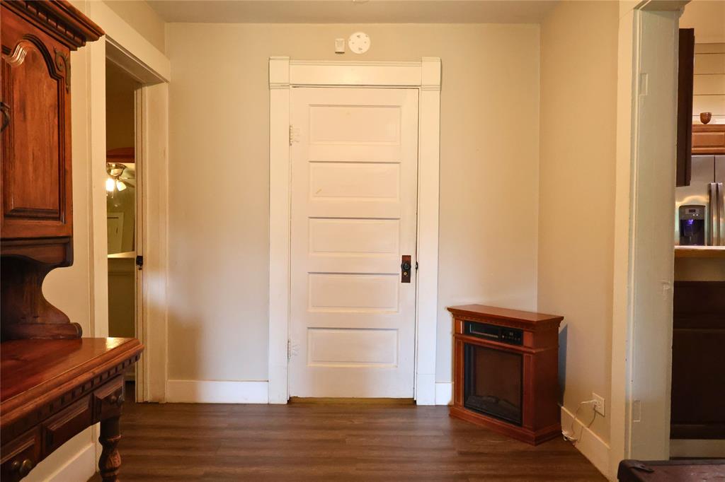 210 Hopkins Street Alba, TX 75410 - Photo 13 of 36 Hall featuring dark wood-style floors and baseboards
