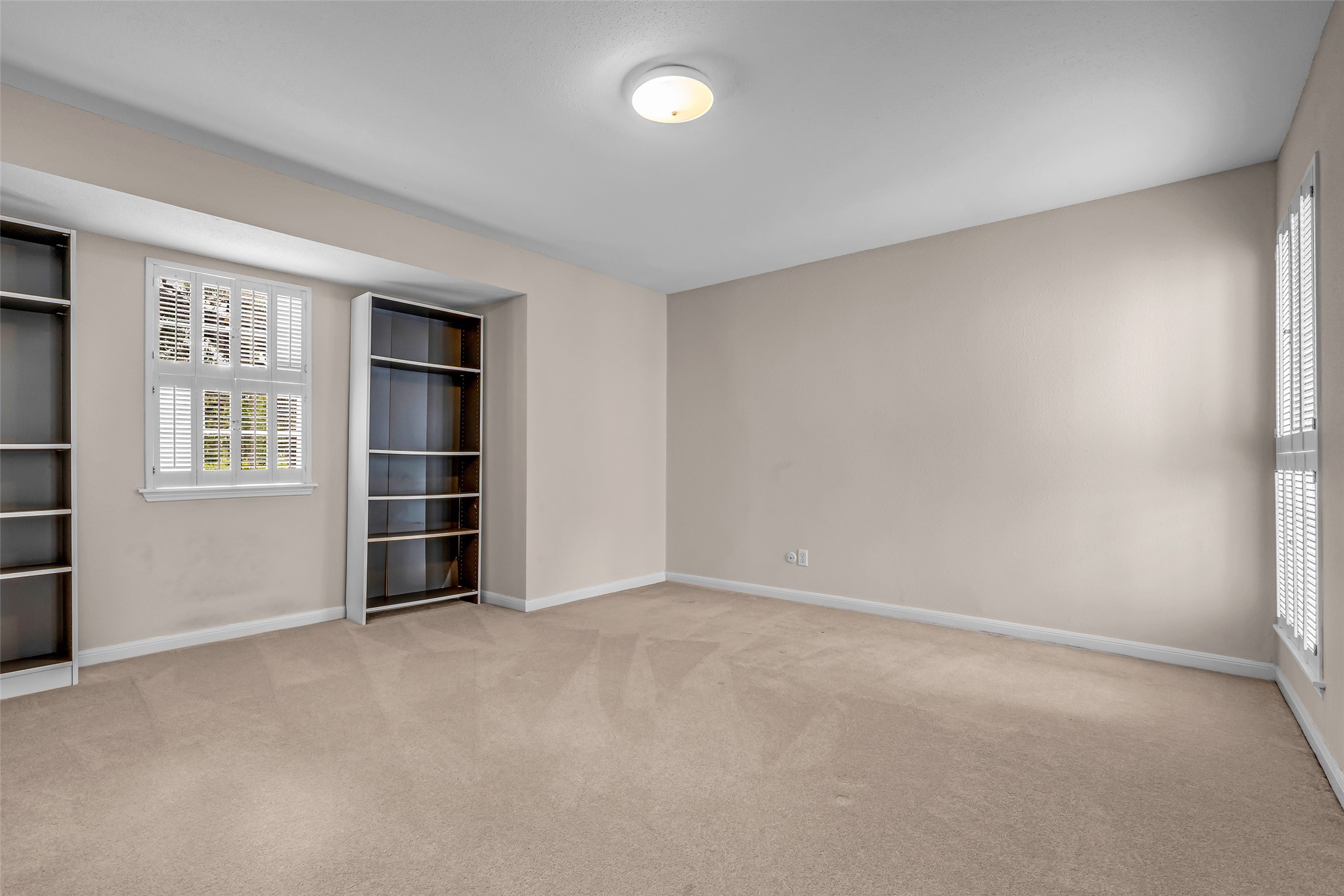 7485 Brompton Street, Unit 7485 Houston, TX 77025 - Photo 34 of 43 The third upstairs bedroom offers an exceptionally roomy layout, complemented by an oversized walk-in closet that provides abundant storage space. With access to a shared bathroom, this versatile bedroom is ideal for family members, guests, or a private retreat.