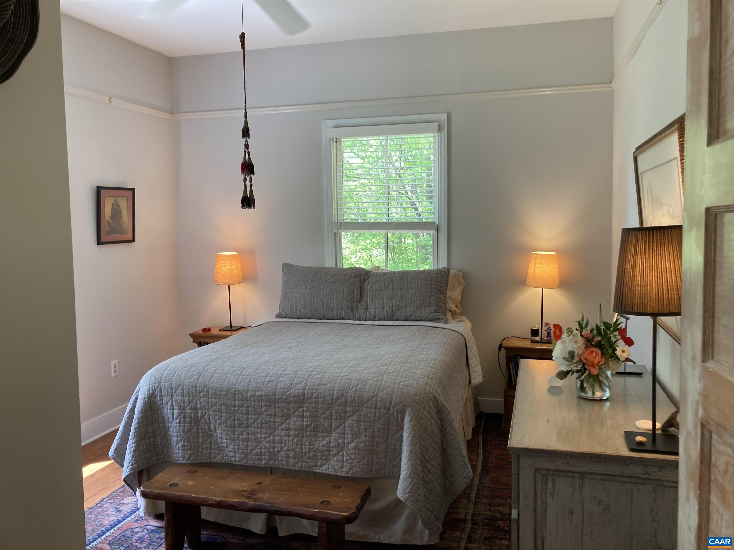 6037 Plank Road Afton, VA 22920 - Photo 20 of 52 a bed room with a bed and a table
