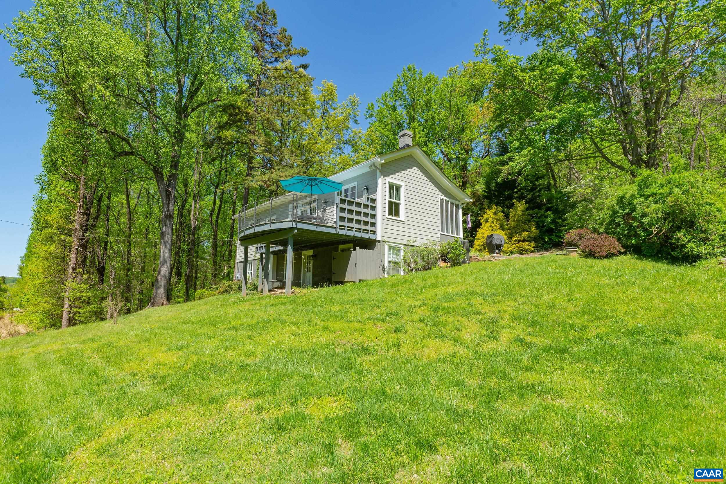 6037 Plank Road Afton, VA 22920 - Photo 33 of 52 a front view of a house with yard and green space