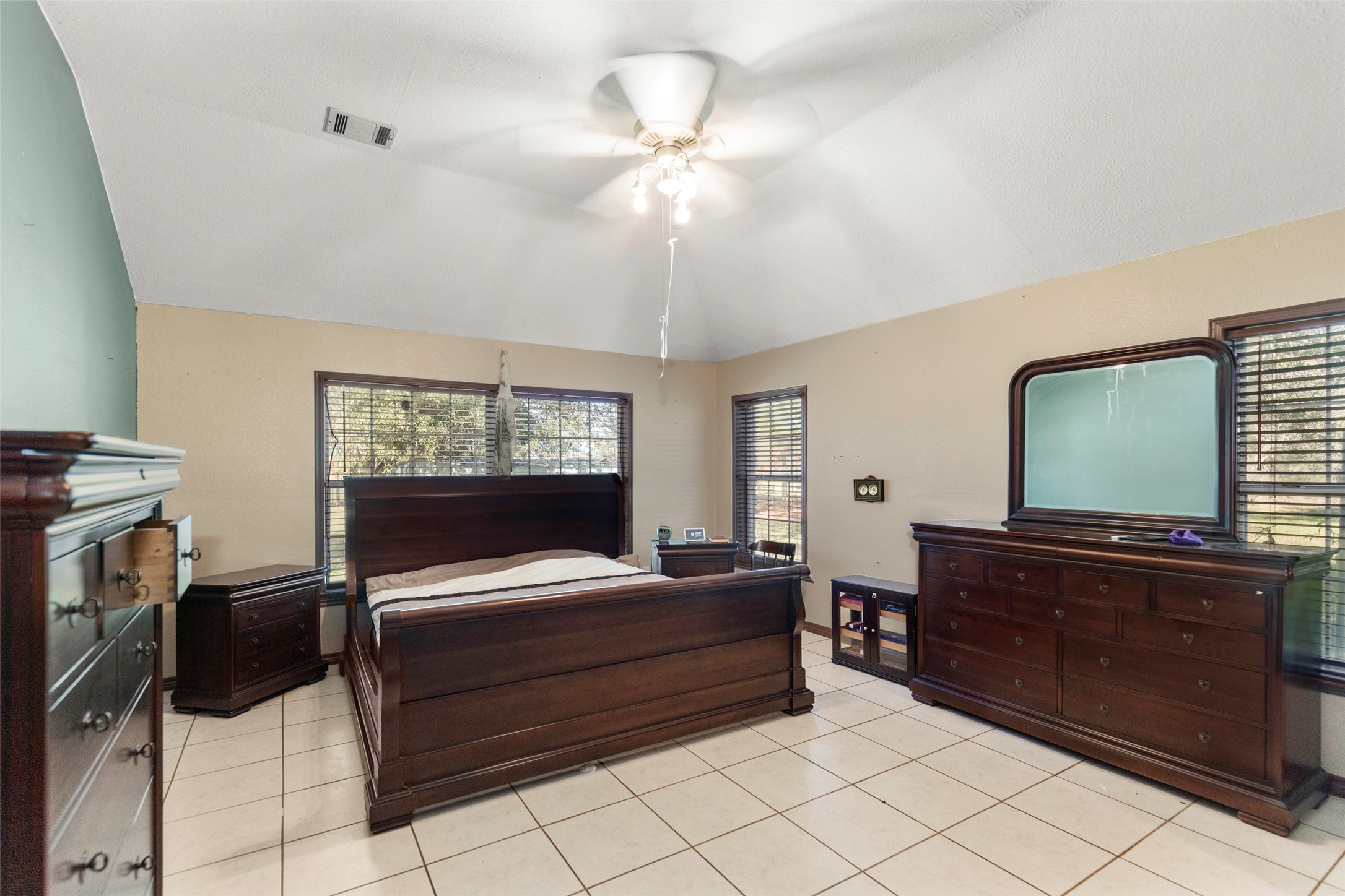 16004 Penick Road Waller, TX 77484 - Photo 20 of 50 a bedroom with a bed and a flat screen tv