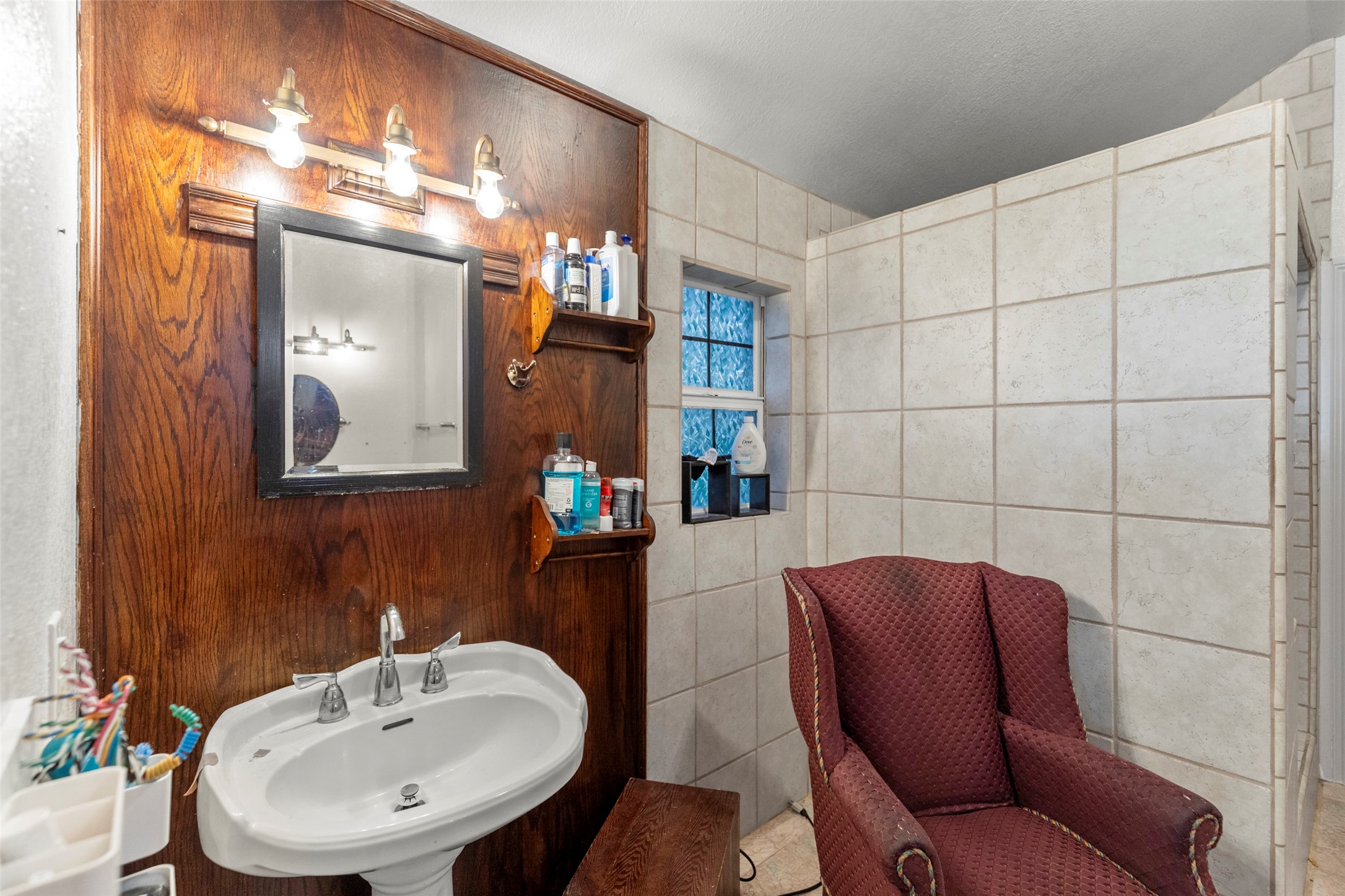 16004 Penick Road Waller, TX 77484 - Photo 22 of 50 a bathroom with a sink mirror and toilet