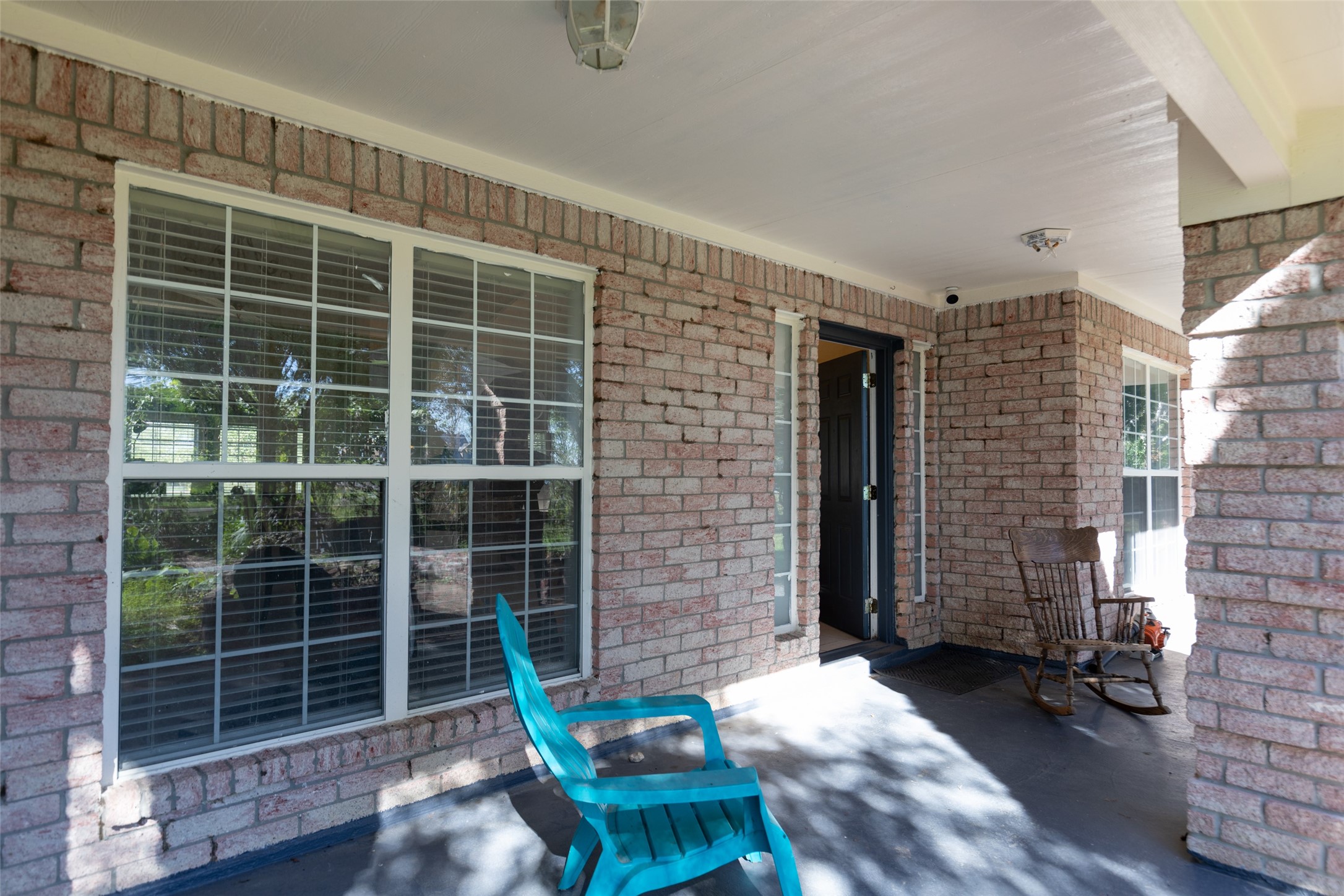 16004 Penick Road Waller, TX 77484 - Photo 8 of 50 a brick building with a table and chairs in front of it