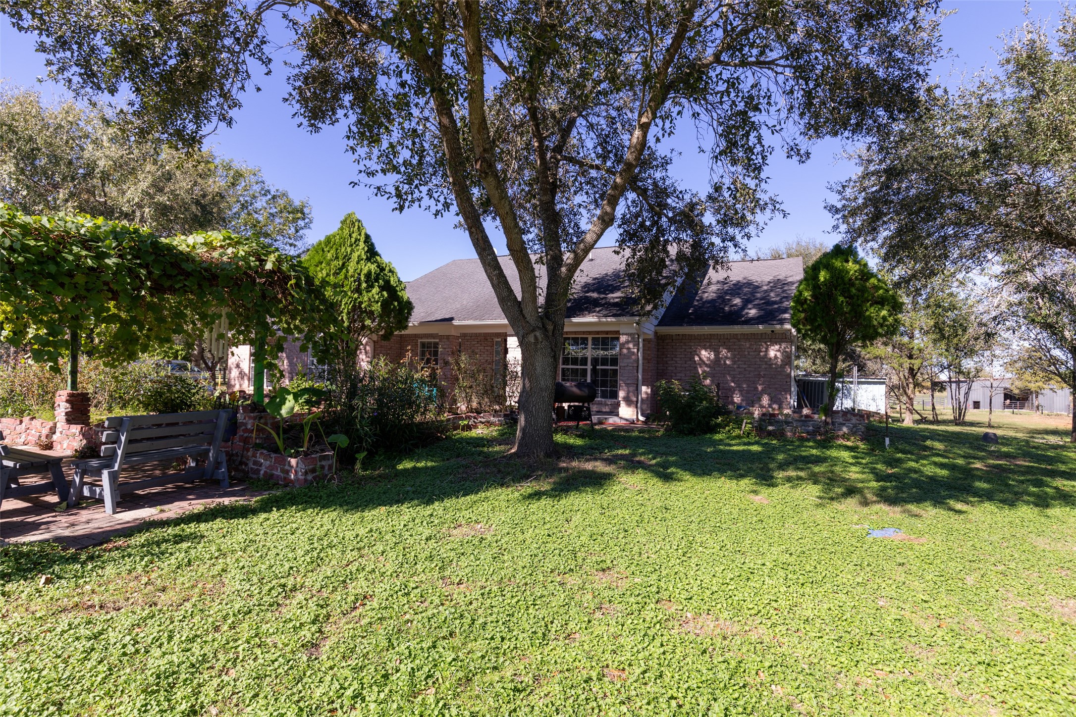 16004 Penick Road Waller, TX 77484 - Photo 9 of 50 a view of a garden with a tree