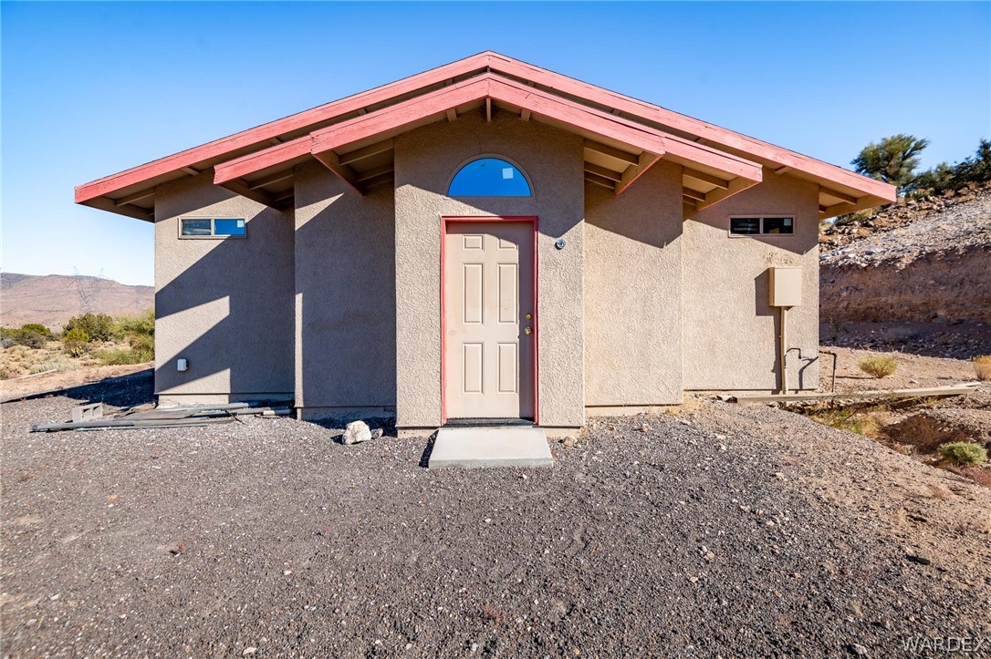 7377 North Frerichs Ranch Road Hackberry, AZ 86411 - Photo 1 of 39 a front view of a house with a yard