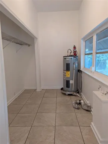 a view of a storage & utility room with two washing machine