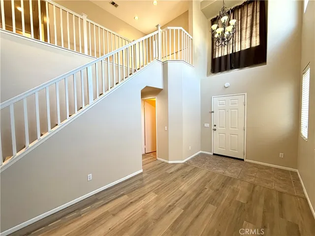 a view of an entryway with wooden floor