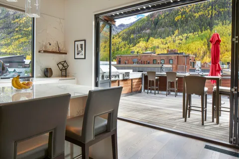 a view of a dining room with furniture window and outside view