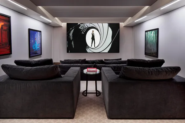 a living room with furniture and a mirror