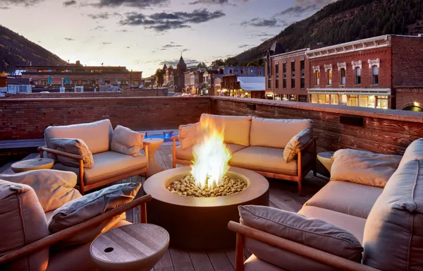 a outdoor living space with furniture and city view