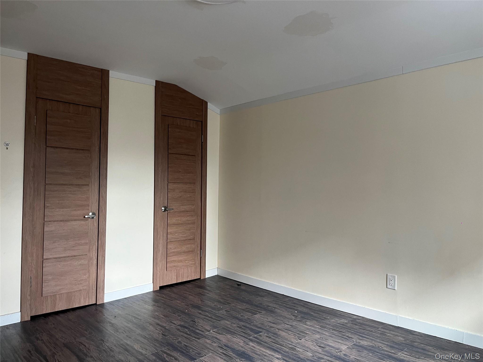 142-01 37th Avenue, Unit 3F Queens, NY 11354 - Photo 3 of 5 a view of an empty room with wooden floor