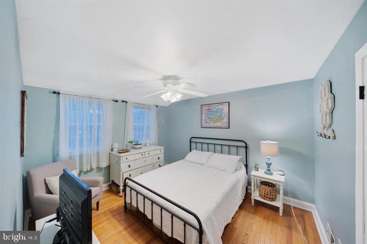 1660 Aberdeen Road Towson, MD 21286 - Photo 13 of 28 a bedroom with a bed and a table in it