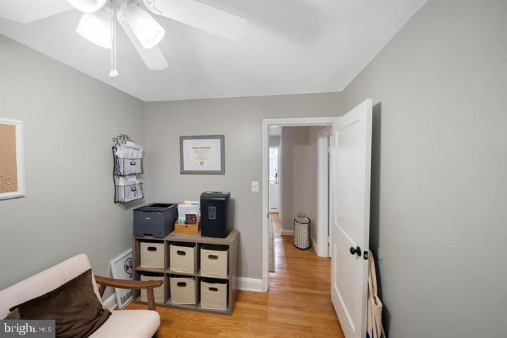 1660 Aberdeen Road Towson, MD 21286 - Photo 17 of 28 a living room with furniture a rug and a chandelier