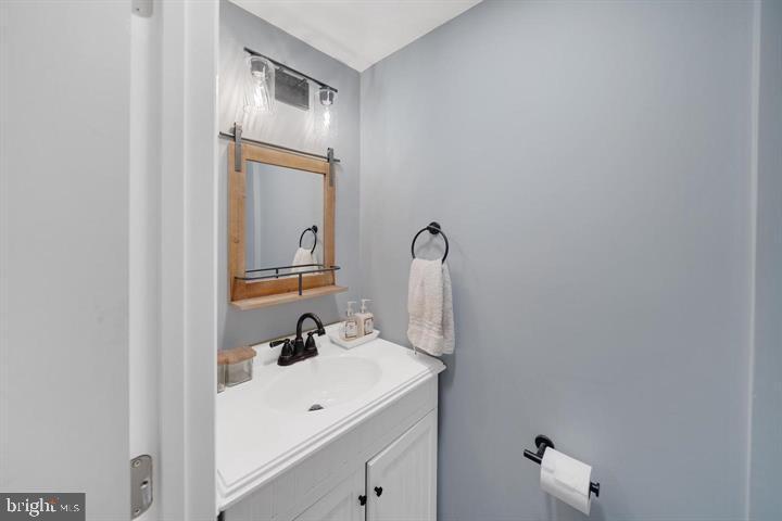 1660 Aberdeen Road Towson, MD 21286 - Photo 19 of 28 a bathroom with a sink and a mirror