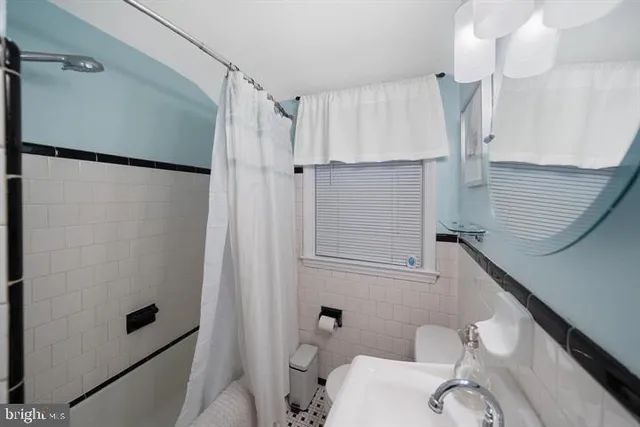 a bathroom with a shower and a toilet