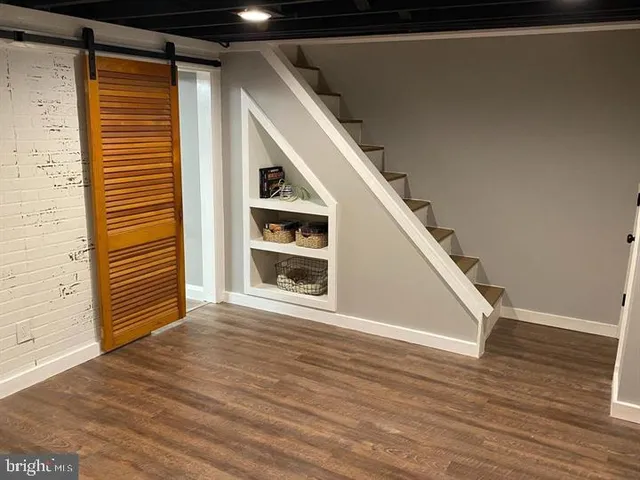 a view of a house with wooden floor and stairs