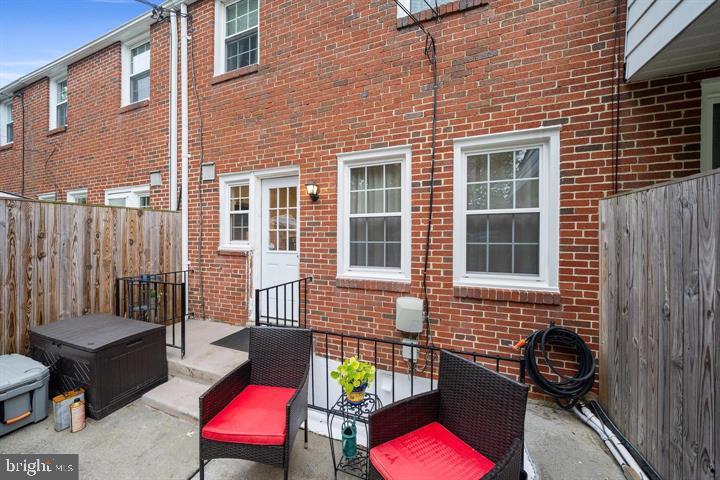 1660 Aberdeen Road Towson, MD 21286 - Photo 25 of 28 a view of a brick house with a chairs in a balcony
