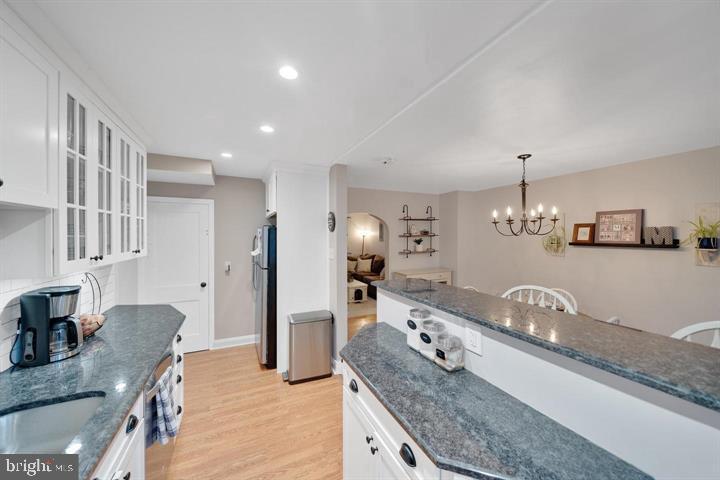 1660 Aberdeen Road Towson, MD 21286 - Photo 7 of 28 a large kitchen with granite countertop a sink and a refrigerator