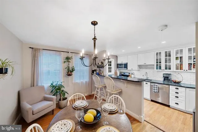 a kitchen with stainless steel appliances granite countertop a sink and cabinets