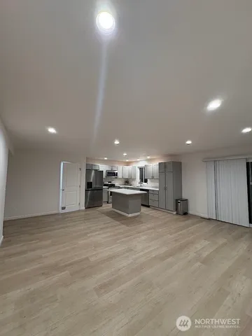 a view of a kitchen with a sink and cabinets
