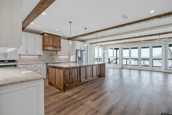 a view of a sink and wooden floor