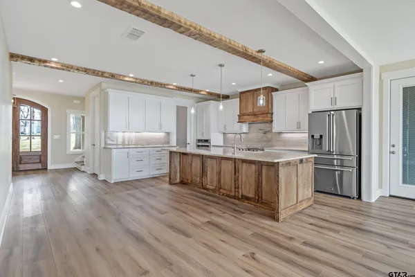 a kitchen with granite countertop a stove and a sink