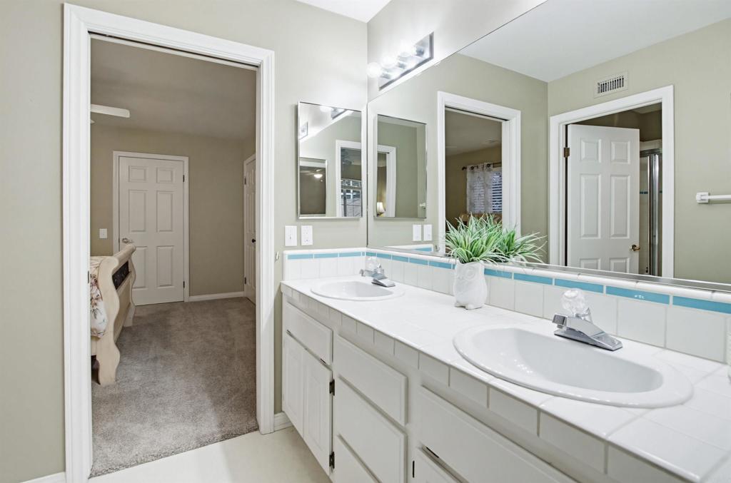 2092 Tudor Lane Fallbrook, CA 92028 - Photo 22 of 52 a bathroom with a sink and a mirror
