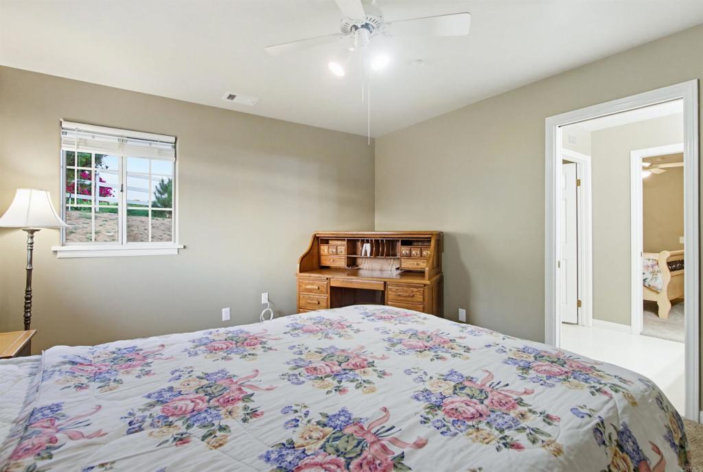 2092 Tudor Lane Fallbrook, CA 92028 - Photo 23 of 52 a bedroom with a bed and a dresser
