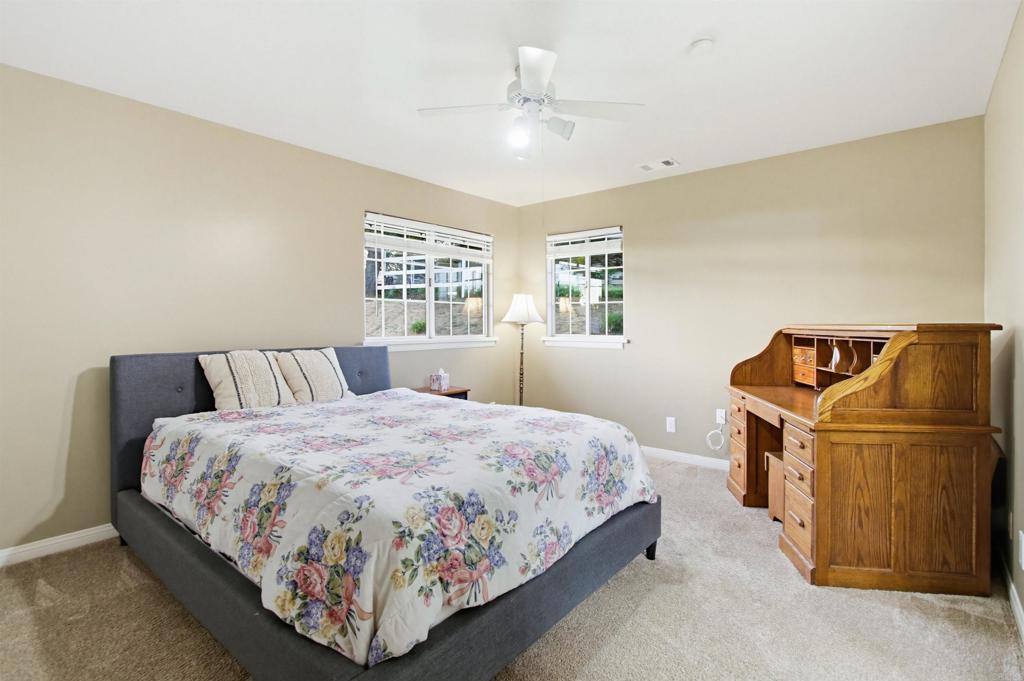 2092 Tudor Lane Fallbrook, CA 92028 - Photo 24 of 52 a bedroom with a bed and window